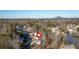 Aerial view of the property and surrounding neighborhood with rolling hills in the background at 577 Alexander Farms Sw Vw, Marietta, GA 30064