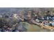 Panoramic aerial shot of the neighborhood with a beautiful lake and surrounding lush trees at 577 Alexander Farms Sw Vw, Marietta, GA 30064