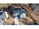 Aerial view of the home showing the driveway, roof, and surrounding landscaping at 577 Alexander Farms Sw Vw, Marietta, GA 30064