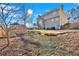 View of the expansive backyard, showcasing the well-maintained lawn and mature trees around the property at 577 Alexander Farms Sw Vw, Marietta, GA 30064