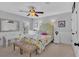 Well-lit bedroom with a floral-patterned bed, accent lamps, and a small desk area at 577 Alexander Farms Sw Vw, Marietta, GA 30064