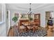 Formal dining room with a chandelier, hardwood floors, elegant furniture and decorative accents at 577 Alexander Farms Sw Vw, Marietta, GA 30064