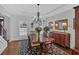 Refined dining room featuring a chandelier, hardwood floors, and traditional furnishings at 577 Alexander Farms Sw Vw, Marietta, GA 30064