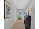 Hallway with neutral paint, artwork, and a roll-top desk at 577 Alexander Farms Sw Vw, Marietta, GA 30064