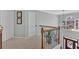 Bright hallway with staircase, featuring a decorative chandelier and view from the entry window at 577 Alexander Farms Sw Vw, Marietta, GA 30064