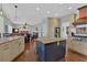 Open kitchen featuring granite counters, a center island, and seamless flow into the living room at 577 Alexander Farms Sw Vw, Marietta, GA 30064