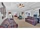 Spacious living room with tray ceiling and comfortable seating, connected to office space at 577 Alexander Farms Sw Vw, Marietta, GA 30064