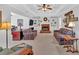 Inviting living room with a brick fireplace flanked by built-in shelving, and comfortable seating at 577 Alexander Farms Sw Vw, Marietta, GA 30064