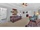 Bright, airy living room with a view of a bathtub in the adjacent bathroom through an open door at 577 Alexander Farms Sw Vw, Marietta, GA 30064