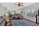 Open-concept living room showcasing hardwood floors, a large window, and comfortable leather furniture at 577 Alexander Farms Sw Vw, Marietta, GA 30064