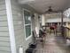 This covered porch features room for seating and ceiling fan at 72 Grayson New Hope Rd, Grayson, GA 30017