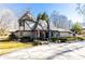 Charming exterior with unique architecture, complemented by well-maintained landscaping and inviting curb appeal at 4210 Gatewood Ln, Peachtree Corners, GA 30097