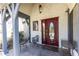 Elegant front door with decorative glass and stone detail, inviting guests into this exceptional home at 4210 Gatewood Ln, Peachtree Corners, GA 30097