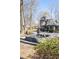Beautiful exterior featuring a water fountain, landscaping, and unique architectural details at 4210 Gatewood Ln, Peachtree Corners, GA 30097