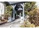 Charming front porch with stone lions and beautiful landscaping at 4210 Gatewood Ln, Peachtree Corners, GA 30097