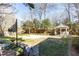 Backyard featuring a pathway leading to an elegant gazebo and a manicured lawn at 4210 Gatewood Ln, Peachtree Corners, GA 30097