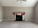 Living room featuring neutral wall colors, and a fireplace with holiday stockings at 4369 Estate St, South Fulton, GA 30349