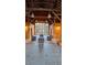 Rustic barn-style interior with exposed wooden beams, high ceilings, and a cozy seating area at 4402 Alysheba Dr, Fairburn, GA 30213