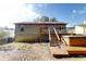 Backyard featuring stairs leading to the back of the house with a detached wooden deck and a jacuzzi at 1284 To Lani Path, Stone Mountain, GA 30083