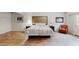 Spacious bedroom featuring wood flooring, a queen bed, with matching night stands and lamps at 1284 To Lani Path, Stone Mountain, GA 30083
