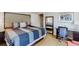 This bedroom offers a spacious retreat with ample natural light, wood floors and a stylish work space at 1284 To Lani Path, Stone Mountain, GA 30083