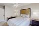 Bright bedroom with a large bed, dark wood furniture, plush carpet and ample natural light at 1284 To Lani Path, Stone Mountain, GA 30083