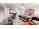 Spacious carpeted bedroom with desk, comfortable chair, ceiling fan, and ample natural light at 1284 To Lani Path, Stone Mountain, GA 30083
