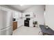 Well-lit kitchen with stainless steel appliances and white cabinets at 1284 To Lani Path, Stone Mountain, GA 30083