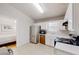 Bright kitchen with stainless steel refrigerator and adjacent bedroom entrance at 1284 To Lani Path, Stone Mountain, GA 30083