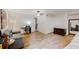 Open living room with hardwood floors, a desk, a comfortable leather couch, and a closet at 1284 To Lani Path, Stone Mountain, GA 30083