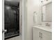 Bathroom with a glass shower, modern vanity, sink, and mirror at 1750 Branch Valley Dr, Roswell, GA 30076