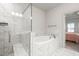 Luxurious bathroom with a shower and a large soaking tub at 1923 Skyfall Ne Cir, Atlanta, GA 30319