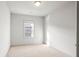 Bright bedroom featuring a window for natural light and neutral carpet flooring at 1923 Skyfall Ne Cir, Atlanta, GA 30319