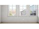 Bedroom featuring three windows for natural light and neutral carpet flooring at 1923 Skyfall Ne Cir, Atlanta, GA 30319