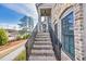 Staircase to covered entrance of lovely home; note brick steps and iron railings at 1923 Skyfall Ne Cir, Atlanta, GA 30319