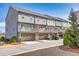 Beautiful townhomes with attached garages and private balconies on a sunny day at 1923 Skyfall Ne Cir, Atlanta, GA 30319