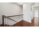 Well-lit hallway with hardwood floors, a staircase, and access to other rooms at 1923 Skyfall Ne Cir, Atlanta, GA 30319