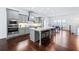 Stylish kitchen with gray cabinets, stainless appliances, large island, and adjacent dining area at 1923 Skyfall Ne Cir, Atlanta, GA 30319