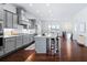 Well-lit kitchen boasts an island with seating and seamlessly connects to the dining area at 1923 Skyfall Ne Cir, Atlanta, GA 30319