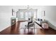 Bright living room features hardwood floors, fireplace, and ample natural light from large windows at 1923 Skyfall Ne Cir, Atlanta, GA 30319