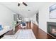 Spacious living area showcasing hardwood floors, a fireplace, and an open layout to the kitchen at 1923 Skyfall Ne Cir, Atlanta, GA 30319