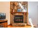 Stone fireplace with a wooden mantel adds character to the living space at 2191 Spear Point Dr, Marietta, GA 30062