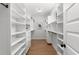 Well-organized walk-in closet with ample shelving and hanging space for clothes and accessories at 231 Sisson Ne Ave, Atlanta, GA 30317