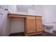 Bathroom featuring a wood vanity with a granite countertop and wood-look floors at 2326 Bigwood Trl, Atlanta, GA 30349