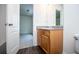 Bathroom features wood cabinets, granite countertops, wood-look flooring, and chrome fixtures at 2326 Bigwood Trl, Atlanta, GA 30349
