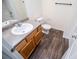 Bathroom featuring a wood vanity with a granite countertop and wood-look floors at 2326 Bigwood Trl, Atlanta, GA 30349