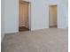 Spacious bedroom with neutral carpet and an open doorway to a closet at 2326 Bigwood Trl, Atlanta, GA 30349