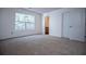 Bedroom with neutral carpet, a window with a view, and a closet at 2326 Bigwood Trl, Atlanta, GA 30349