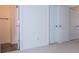 Bedroom with neutral carpet and a view into the closet space at 2326 Bigwood Trl, Atlanta, GA 30349
