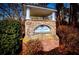 A brick and stone sign for Thornwood Park surrounded by green bushes and trees at 2326 Bigwood Trl, Atlanta, GA 30349
